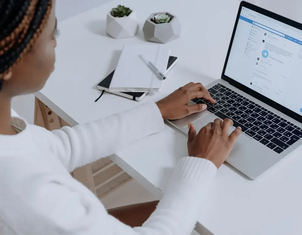 Business owner running Facebook ads on a laptop